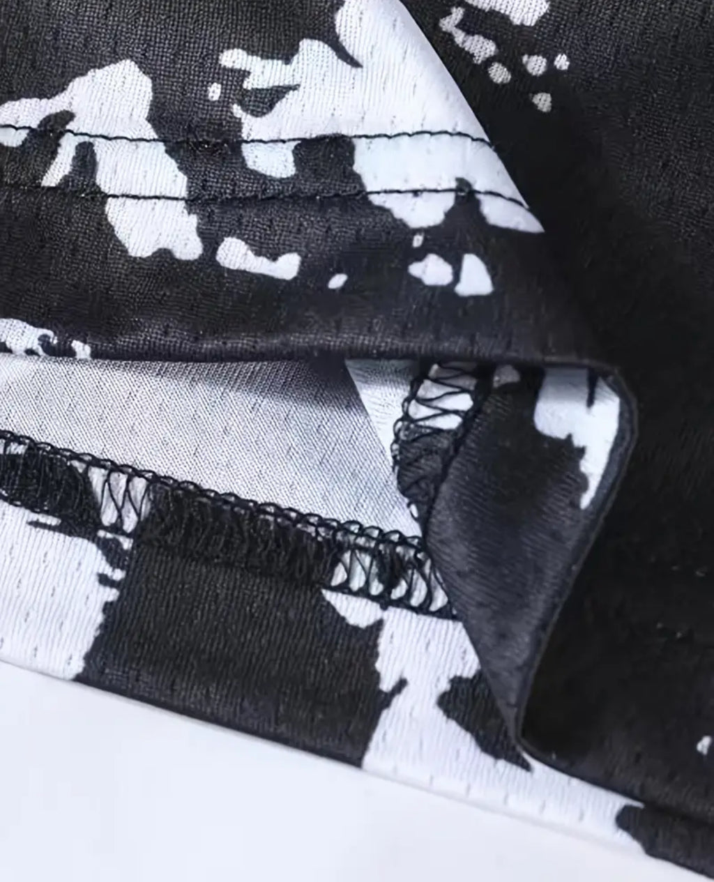 MESH GRAPHIC SHORTS